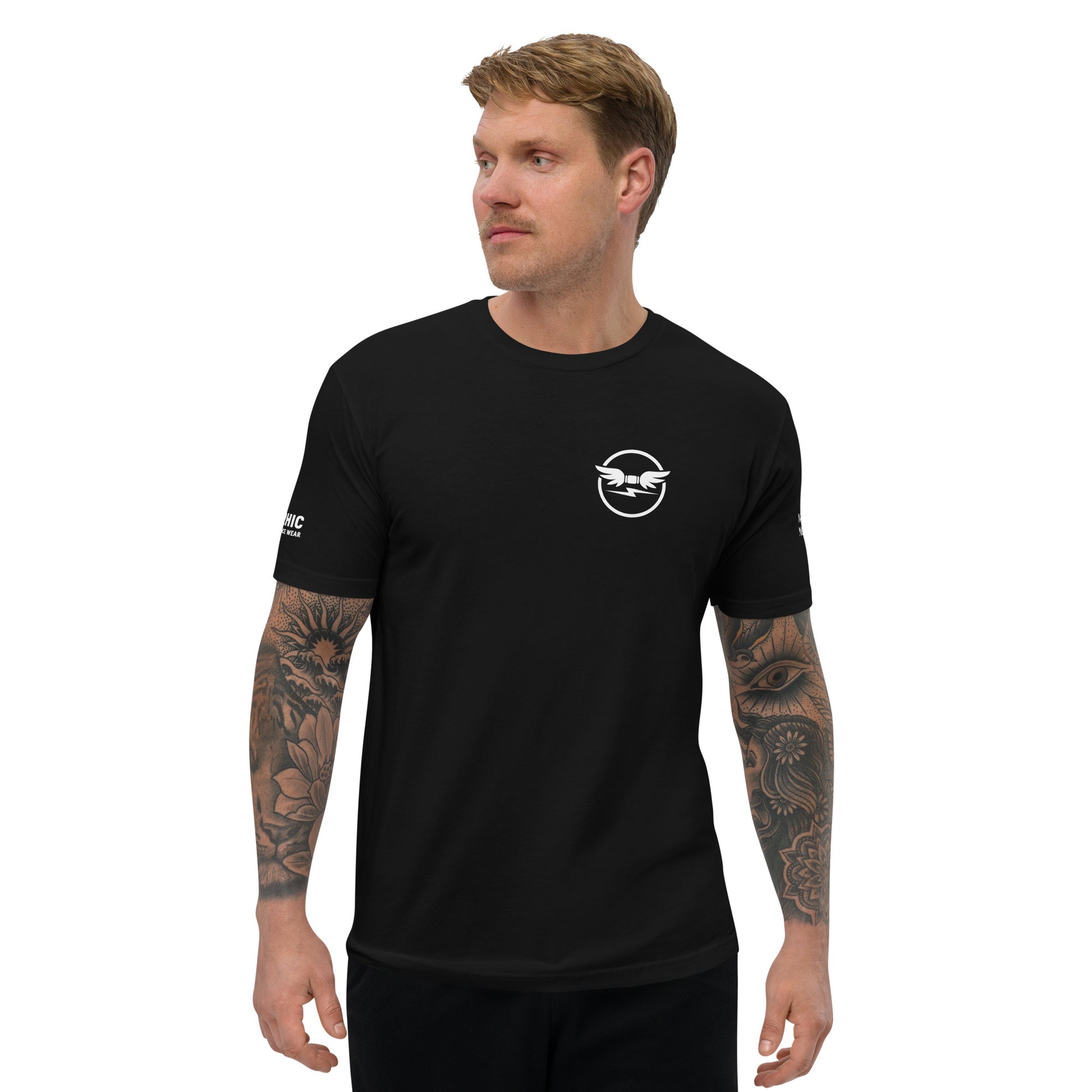 Man wearing a black t-shirt with the pyrrhic wingmark logo on the chest and pyrrhic brand name and drc insgina on  on a white background