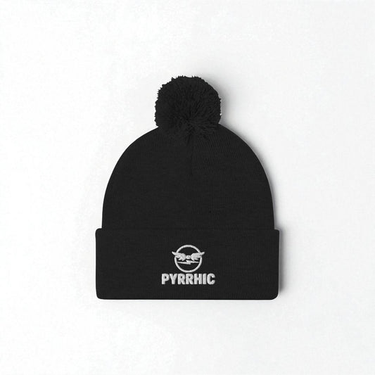 Black beanie with pom-pom and 'PYRRHIC' logo on a white background